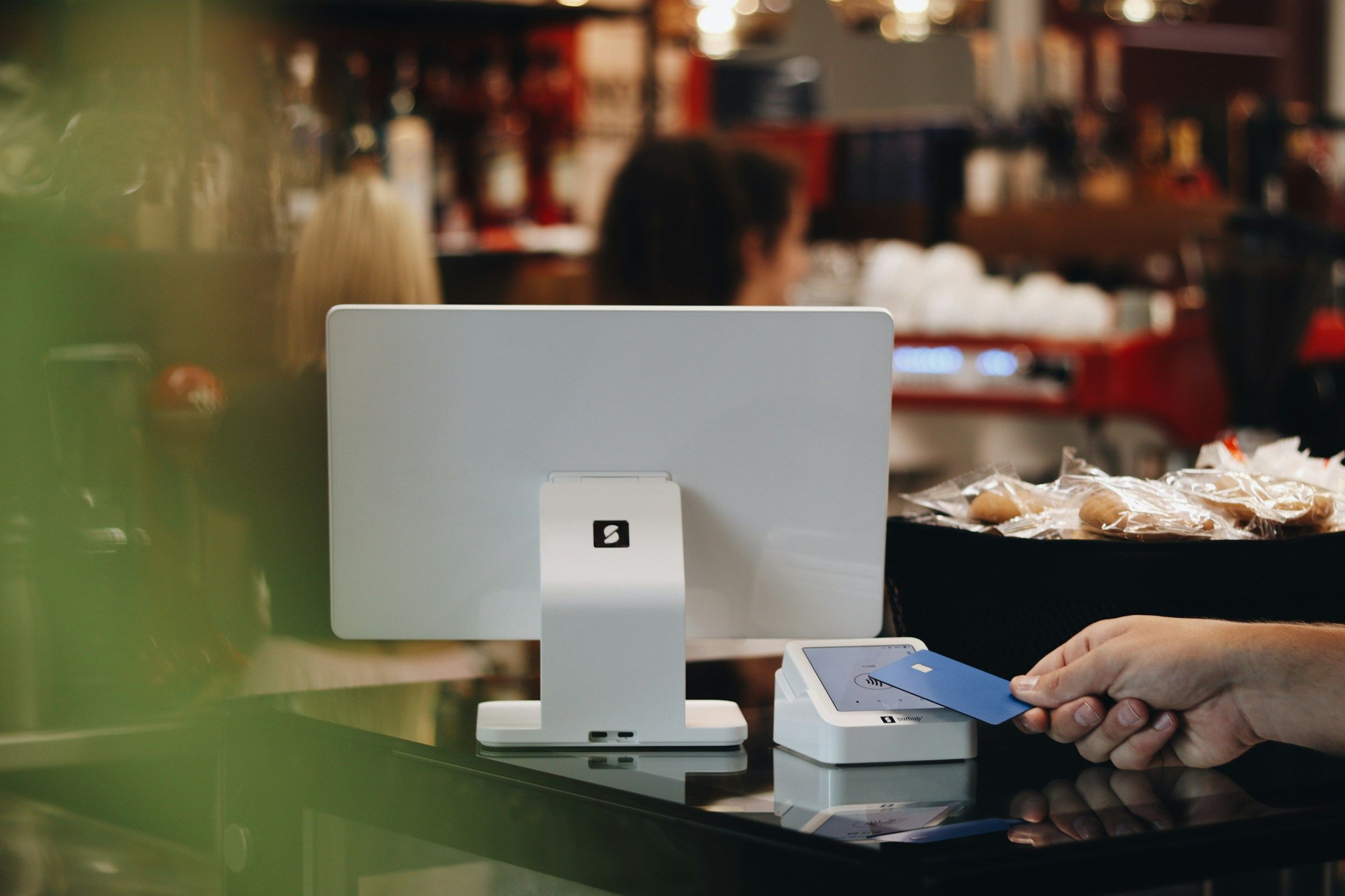 Contactless card payment on an EPOS terminal at a venue counter